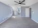 Carpeted bonus room featuring multiple windows and doors, providing ample natural light and access at 357 Riverwood Dr, Clayton, NC 27527