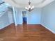 Open dining area with hardwood floors next to a glimpse of the kitchen at 357 Riverwood Dr, Clayton, NC 27527