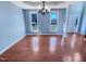 Formal dining room featuring hardwood floors, a stylish chandelier, and bright windows at 357 Riverwood Dr, Clayton, NC 27527