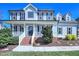 Charming two-story home with a welcoming front porch, beautiful landscaping, and classic curb appeal at 357 Riverwood Dr, Clayton, NC 27527