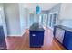 Kitchen featuring dark granite island, stainless steel appliances, and hardwood floors at 357 Riverwood Dr, Clayton, NC 27527