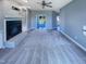 A living room with carpet floors, a fireplace, built-in shelves, and neutral paint at 357 Riverwood Dr, Clayton, NC 27527