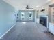 Bright living room features a cozy fireplace, built-in shelving, and neutral decor for a comfortable atmosphere at 357 Riverwood Dr, Clayton, NC 27527