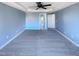 An empty main bedroom with carpeted floors, neutral wall color, and a ceiling fan at 357 Riverwood Dr, Clayton, NC 27527