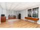 Basement featuring a wet bar, mini fridge, wooden cabinets, finished ceiling, and vinyl plank flooring at 3601 Tartancroft Pl, Fuquay Varina, NC 27526