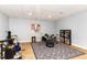 Finished basement featuring a finished ceiling, a drum set, laminate flooring, and neutral paint at 3601 Tartancroft Pl, Fuquay Varina, NC 27526