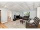Finished basement featuring an accent ceiling, recessed lighting, and a comfortable leather reclining sofa at 3601 Tartancroft Pl, Fuquay Varina, NC 27526