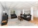 Basement living room with accent ceiling, recessed lights, durable floors, and comfortable leather reclining furniture at 3601 Tartancroft Pl, Fuquay Varina, NC 27526