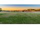 Expansive backyard showcasing a serene lake surrounded by lush trees and well-manicured lawn at 390 Lake Magnolia Way, Smithfield, NC 27577