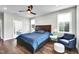 Bedroom showcasing natural light, ceiling fan, hardwood floors, and neutral paint at 390 Lake Magnolia Way, Smithfield, NC 27577