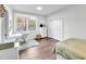 Well-lit bedroom featuring hardwood floors, a large window, and ample closet space at 390 Lake Magnolia Way, Smithfield, NC 27577