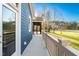 Inviting deck showcasing the siding, with a view of the expansive yard and surrounding landscape at 390 Lake Magnolia Way, Smithfield, NC 27577