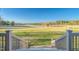 Beautiful landscape view from deck showcasing a serene lake surrounded by lush trees at 390 Lake Magnolia Way, Smithfield, NC 27577