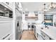 Bright kitchen featuring a large island, stainless steel appliances, and a farmhouse sink at 390 Lake Magnolia Way, Smithfield, NC 27577