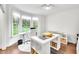 Bright office space features large bay window, white trim, hardwood floors, and built-in storage at 390 Lake Magnolia Way, Smithfield, NC 27577