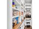 Well-organized walk-in pantry with abundant shelving and wooden countertops at 390 Lake Magnolia Way, Smithfield, NC 27577