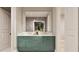 Modern bathroom with a double vanity, green cabinets, and gold hardware at 3908 Cedar Knolls Dr, Youngsville, NC 27596