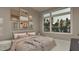 Bright bedroom with cozy decor, large window and desert-themed art at 3908 Cedar Knolls Dr, Youngsville, NC 27596