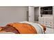 Modern bedroom featuring an adjacent sitting room with a television and staircase at 3908 Cedar Knolls Dr, Youngsville, NC 27596