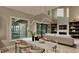 Open concept dining room with view of the living room, large windows, and stylish pendant lighting at 3908 Cedar Knolls Dr, Youngsville, NC 27596
