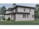 Exterior features mixed siding, sleek windows, and verdant landscaping at 3908 Cedar Knolls Dr, Youngsville, NC 27596