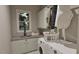 Efficient laundry room features a sink, ample counter space, and modern front load washer and dryer at 3908 Cedar Knolls Dr, Youngsville, NC 27596