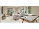 Bright and airy living room with a lounge area and air hockey table at 3908 Cedar Knolls Dr, Youngsville, NC 27596