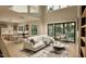 Bright living room with a modern design, large windows, and open floor plan to kitchen at 3908 Cedar Knolls Dr, Youngsville, NC 27596
