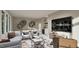 Modern living room featuring a pool table, custom shelving, and a small bar at 3908 Cedar Knolls Dr, Youngsville, NC 27596