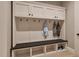 Well-organized mudroom with coat hooks, bench seating, and storage cubbies at 3908 Cedar Knolls Dr, Youngsville, NC 27596