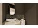 Stylish powder room with unique wallpaper, elegant fixtures, and a sleek vessel sink at 3908 Cedar Knolls Dr, Youngsville, NC 27596