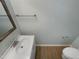 Bathroom with a white sink, chrome fixtures and a modern mirror at 4216 High Mountain Dr, Raleigh, NC 27603