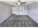 Bedroom showing gray carpet and walls, and showing two doors and a bathroom in the background at 4216 High Mountain Dr, Raleigh, NC 27603
