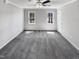 Bedroom featuring plush gray carpeting, a ceiling fan, and two large windows at 4216 High Mountain Dr, Raleigh, NC 27603