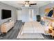 This bedroom features neutral gray walls, carpet, ceiling fan, and is virtually staged at 4216 High Mountain Dr, Raleigh, NC 27603