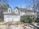 Charming two-story traditional home featuring a two-car garage, dormers, and well-manicured landscaping at 4216 High Mountain Dr, Raleigh, NC 27603