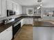 Bright kitchen featuring stainless steel appliances, granite countertops and a large island at 4216 High Mountain Dr, Raleigh, NC 27603