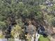 An elevated view of the property, showing its position amid lush, mature trees at 4815 Fortunes Ridge Dr, Durham, NC 27713