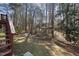 View of the property's backyard and surrounding trees at 4815 Fortunes Ridge Dr, Durham, NC 27713