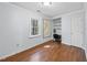 Bright bedroom with hardwood floors, natural lighting, a window view, and closet space at 4815 Fortunes Ridge Dr, Durham, NC 27713