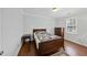 Relaxing bedroom with hardwood floors, neutral walls, and closet space at 4815 Fortunes Ridge Dr, Durham, NC 27713