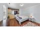 Comfortable bedroom with hardwood floors, closet with storage, and natural lighting at 4815 Fortunes Ridge Dr, Durham, NC 27713