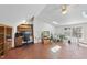 Spacious bonus room with built-ins, ceiling fan, and a view of the natural landscaping outside the windows at 4815 Fortunes Ridge Dr, Durham, NC 27713