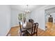 Inviting dining room featuring a chandelier and hardwood flooring at 4815 Fortunes Ridge Dr, Durham, NC 27713