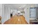 Bright kitchen features hardwood floors, white appliances, and ample cabinet storage space at 4815 Fortunes Ridge Dr, Durham, NC 27713