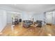 Spacious living room with hardwood floors connecting to an elegant dining area at 4815 Fortunes Ridge Dr, Durham, NC 27713