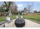 Backyard features a stylish fire pit area with comfortable seating for outdoor entertaining and relaxation at 4900 Skidmore St, Raleigh, NC 27609