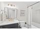 Charming bathroom with a modern vanity, subway tile, and stylish gold fixtures at 4900 Skidmore St, Raleigh, NC 27609