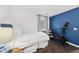 Bedroom features hardwood floors, natural light, and a Peloton exercise bike, blending comfort with a fitness-friendly atmosphere at 4900 Skidmore St, Raleigh, NC 27609