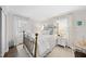 Serene bedroom features a brass bed frame, light-filled windows, and neutral decor for a calming atmosphere at 4900 Skidmore St, Raleigh, NC 27609